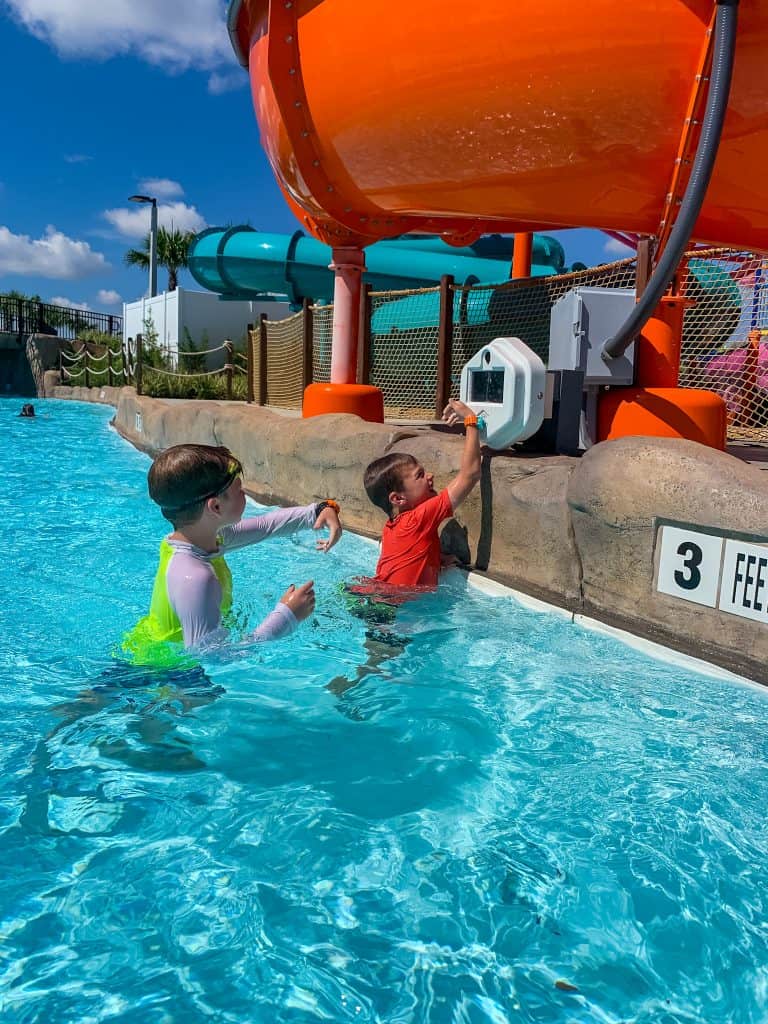 boys collecting points in lazy river at Island H2O Live water park in Orlando